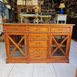 Rustic solid pine sideboard with side display cases and multiple drawers.