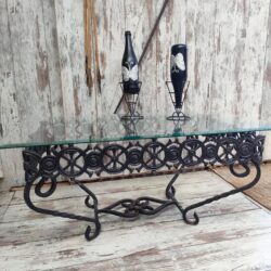 Vintage wrought iron table with beveled glass. Artisan design