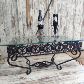 Vintage wrought iron table with beveled glass. Artisan design