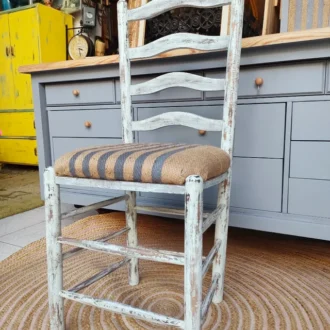 Solid Distressed Wood Chair with White Finish and Decorative Woven Seat.