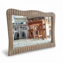 Natural rattan mirror with handmade frame and organic shape. Light, warm and with Mediterranean style. Measurements: 87 cm hip × 68cm high